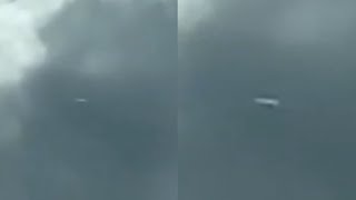 Watch Large Cigar Shaped UFO Vanishes Into Cloud over Asheville, North Carolina (US)