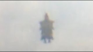 Watch Flying Humanoid Figure Filmed In The Sky Over Maryhill In Glasgow, Scotland.