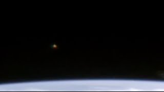 Watch UFO Sighting with Orange Lights above Earth's Surface (ISS) - FindingUFO