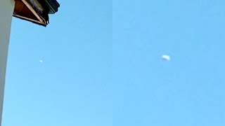 Watch Disk Shaped UFO in Cloudless Sky Filmed by Kid on Rooftop over the Philippines - FindingUFO