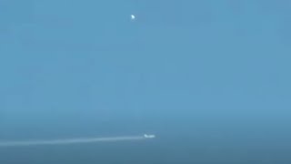 Watch Two Glowing UFOs Following and Observing Passenger Airplane over Manchester, England (UK)