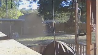 Watch Ghostly Figure Captured On Home Security Camera Looking Through The Backyard Porch Window.